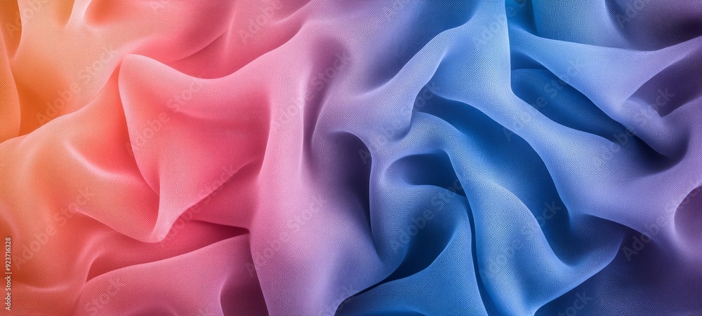 Obraz premium Abstract Swirls of Color: A captivating close-up of a gradient fabric, its soft folds and ripples creating a mesmerizing abstract pattern in a spectrum of hues. 