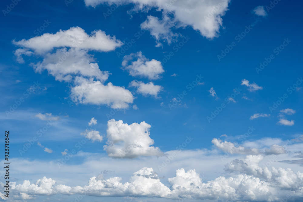 Obraz premium clouds and blue sunny sky, white clouds over blue sky, Aerial view, nature blue sky white cleat weather.