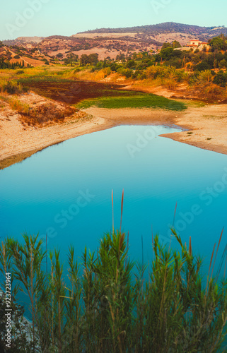 Blue lake in the hilly terrain