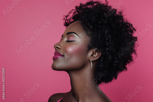 A close up of a black woman's face with her eyes closed