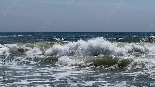 Very rough Atlantic Ocean Waves formed from Hurricane Debby rolling on to the Shore of Fire Island New York. photo