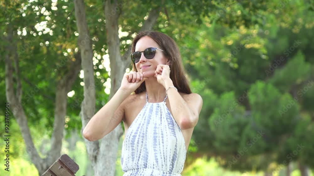 Reduce Jaw Line Face Yoga Exercise girl doing in park in nature close-up Reduce Jaw Line Face Yoga Exercise girl doing in park in nature close-up