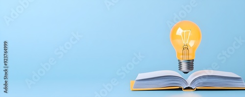 Light bulb with a book, knowledge and ideas fueling growth, flat design illustration photo