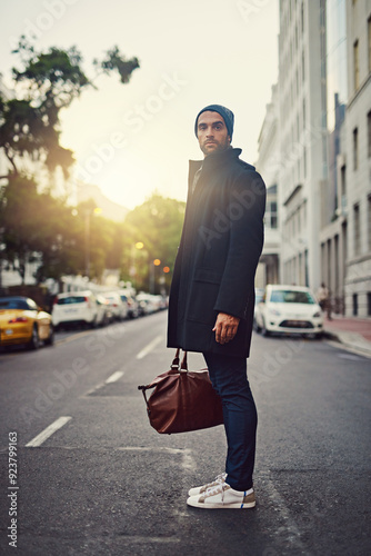 Fashion, portrait and man in city, bag and luggage on street for taxi, travel and jacket for trend. Outdoor, road and clothes of guy in winter of New York, stylish and lawyer on sidewalk and waiting