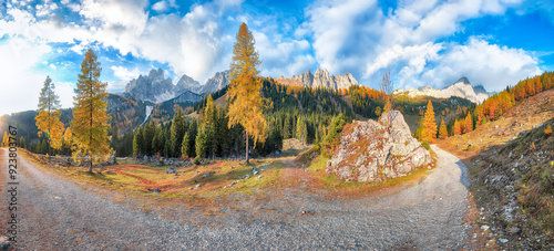 Astonishing view of mountains and valleys with larch forest and wonderful sky are located in Filzmoos