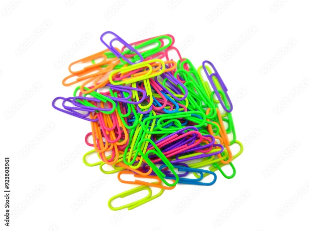 Top view of a pile of paper clips, showcasing a mix of bright colors, isolated on white background. Top view of a pile of paper clips, showcasing a mix of bright colors, isolated on white background.