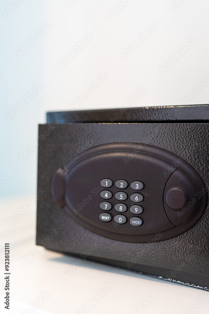 Black safe in the closet of a hotel room, safety and security Black safe in the closet of a hotel room, safety and security
