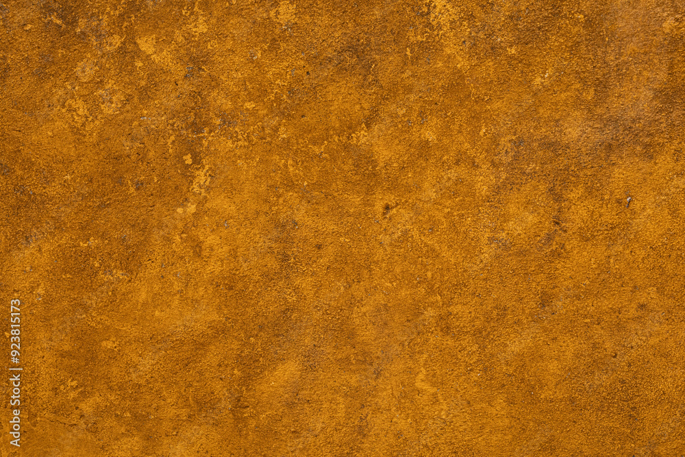 A close up of an aged textured ochre wall A close up of an aged textured ochre wall