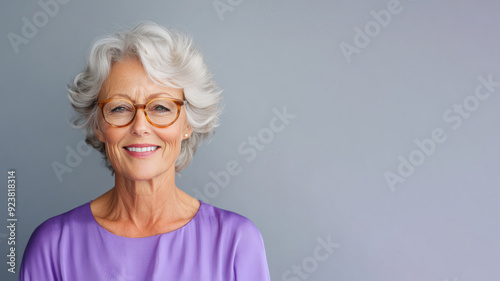 Wallpaper Mural Senior Australian woman wearing purple dress smile isolated on gray background Torontodigital.ca