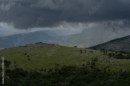 Dark storm clouds hang threateningly over the Croatian mountains.