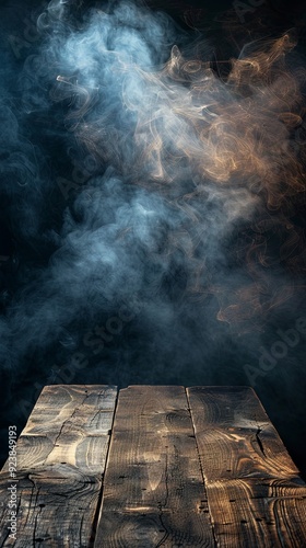 Wooden table with dark smoke background