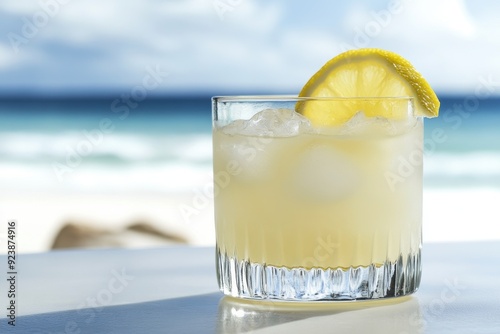 Refreshing lemonade on sunny beachside table