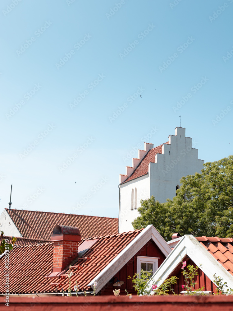 Fototapeta premium Wooden houses and the church tower in the small town of Kristianopel, Blekinge, Sweden