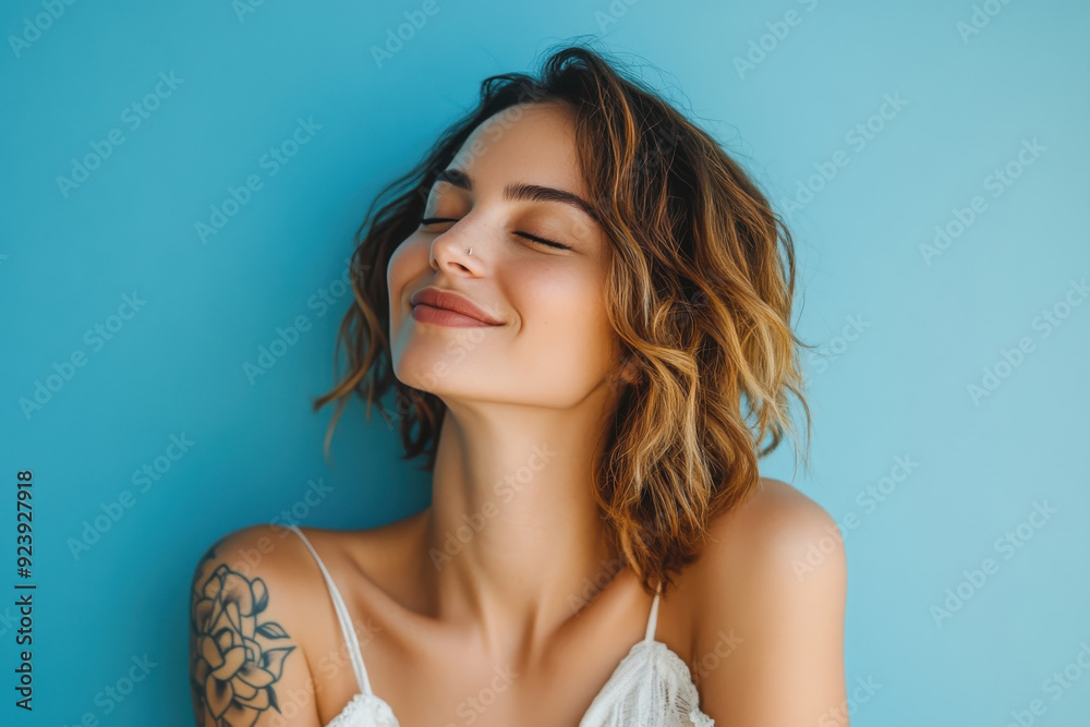 A close up of a woman's face with tattoos and her eyes closed A close up of a woman's face with tattoos and her eyes closed