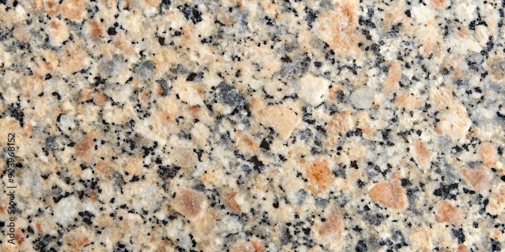 Natural Granite Texture - Warm Hues and Fine Grain. A closeup image of polished granite featuring a warm palette of beige, cream, and black in a fine-grained pattern. Ideal for backgrounds, textures. Natural Granite Texture - Warm Hues and Fine Grain. A closeup image of polished granite featuring a warm palette of beige, cream, and black in a fine-grained pattern. Ideal for backgrounds, textures.