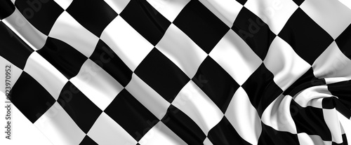 The checkered flag waves in the wind signifying the end of a race