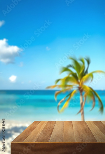 Top of wood table with seascape and palm tree  blur bokeh light of calm sea and sky at tropical beach background