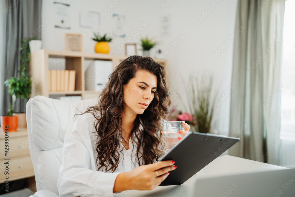 Young caucasian business woman working in office on laptop Young caucasian business woman working in office on laptop