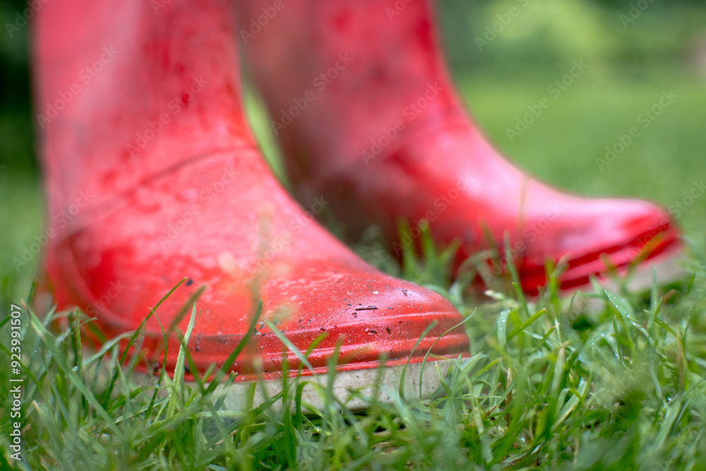 Red rain boots for protection against rainy weather.