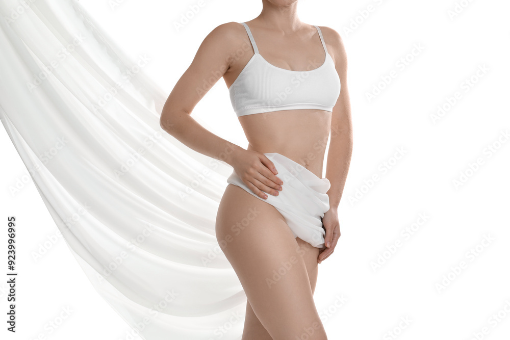 Fototapeta premium Woman covering her slim body with silk fabric against white background, closeup
