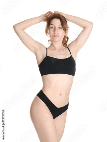 Woman with slim body posing on white background