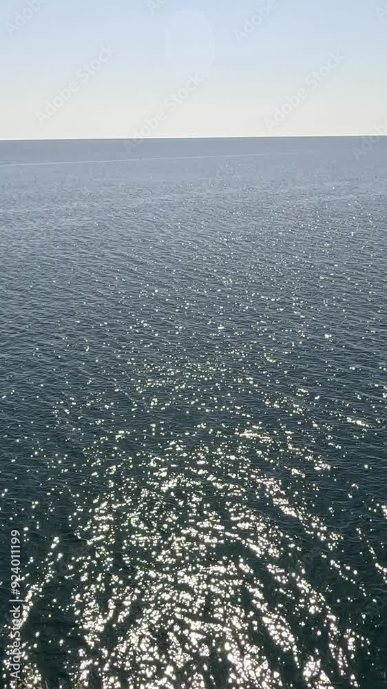 Sea water surface. Low angle view from kayak, camera flies over clear sea water. Nobody. Holiday recreation concept. Abstract nautical summer ocean nature. Slow motion. Close up. Vertical video Sea water surface. Low angle view from kayak, camera flies over clear sea water. Nobody. Holiday recreation concept. Abstract nautical summer ocean nature. Slow motion. Close up. Vertical video