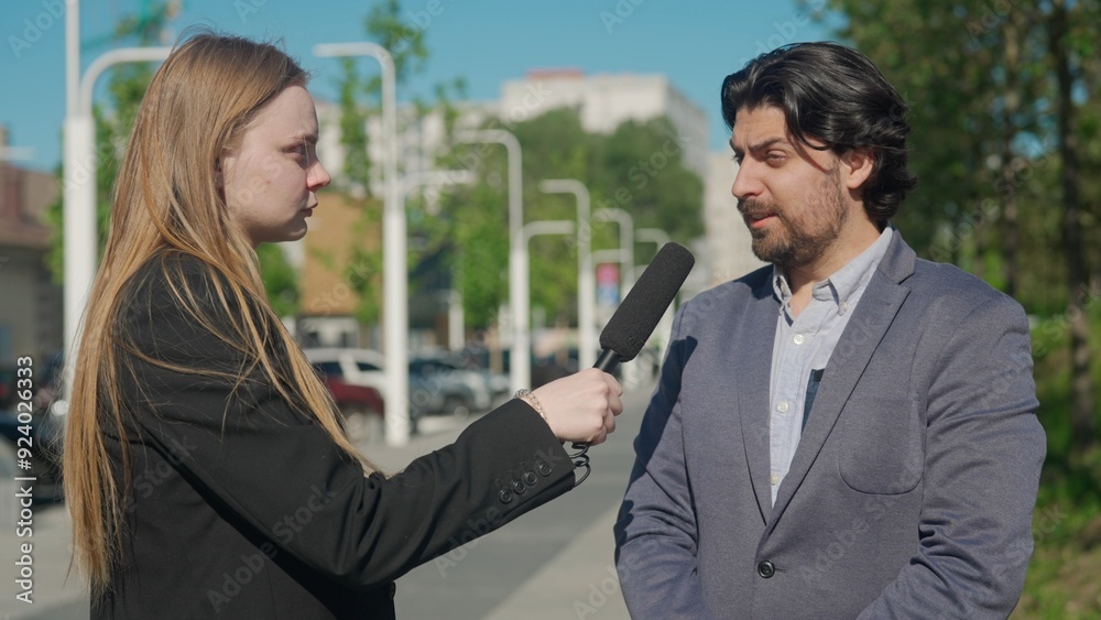 Outdoor interview in the park: Reporter Discusses with Local Expert Outdoor interview in the park: Reporter Discusses with Local Expert