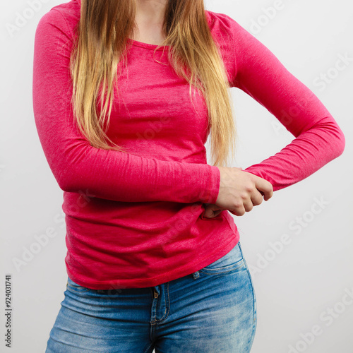 Woman chest, pink blouse and long hair photo