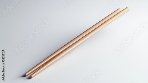 Pair of Wooden Chopsticks Lying on a Smooth White Surface