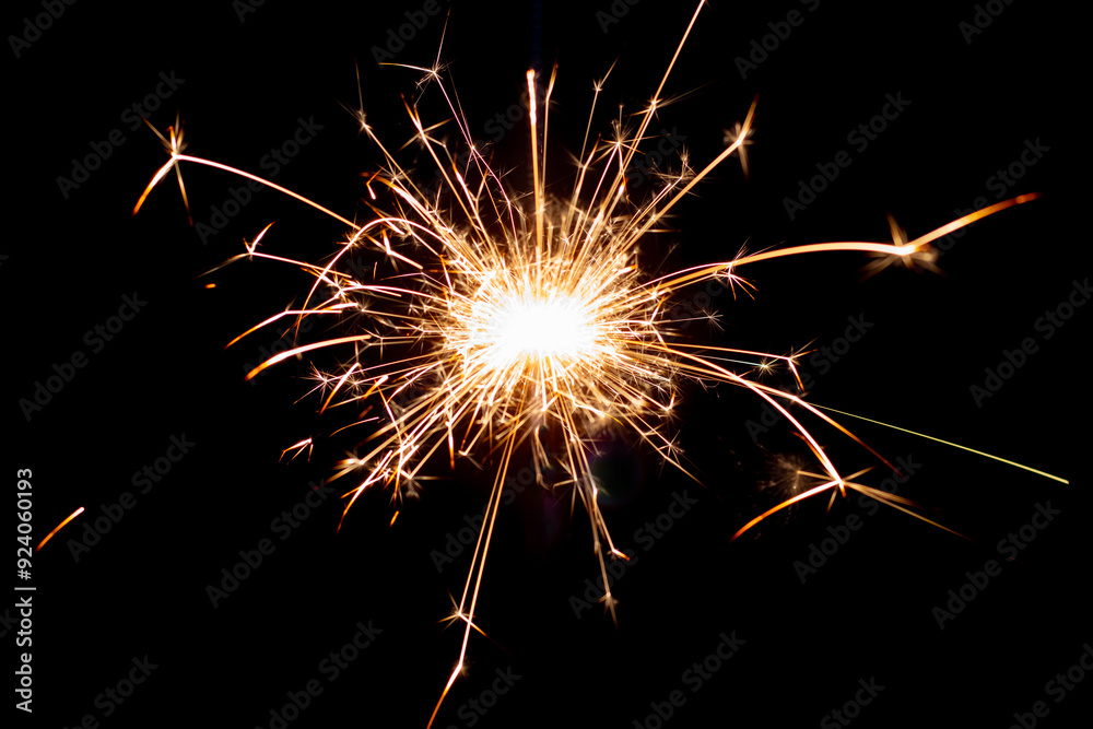 Sparklers on black isolated background. Sparks from a burning sparkler. To insert an image in a blend mode Sparklers on black isolated background. Sparks from a burning sparkler. To insert an image in a blend mode