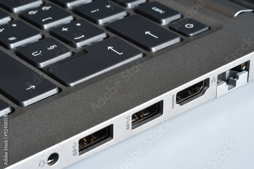 Detail of headphone jacks, usb ports, hdmi and rj45 lan port on the side of a modern laptop photo