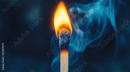  A stick with a flame at its center emitting smoke from the top