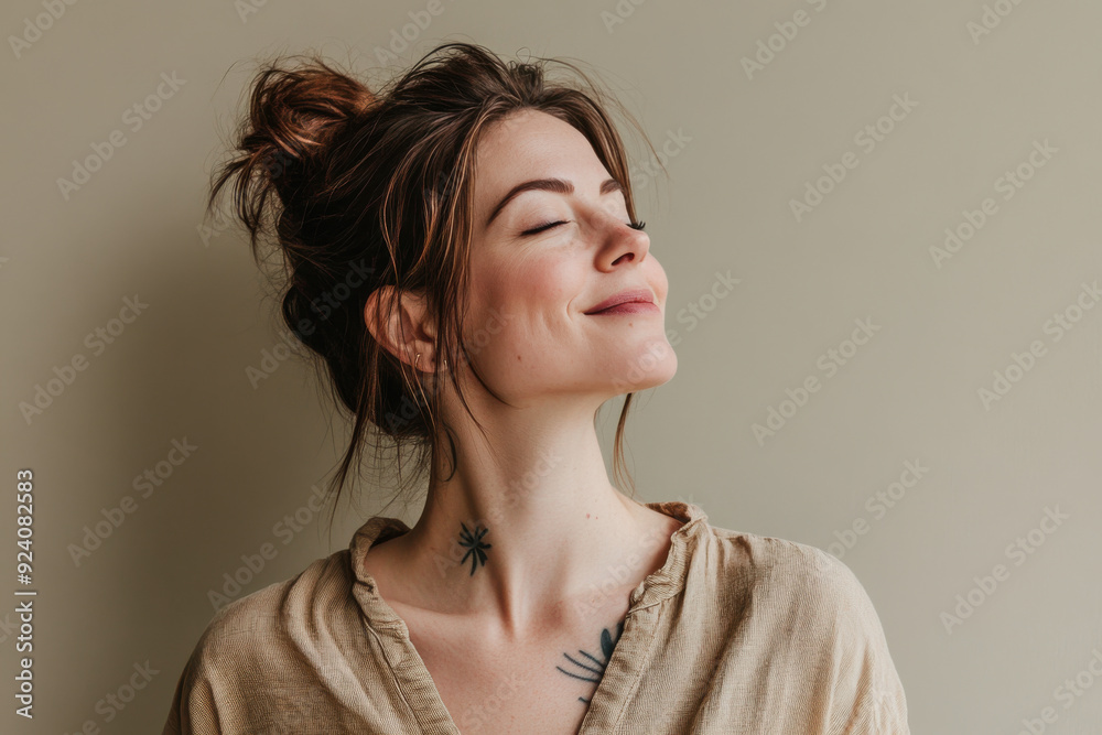 A close up of a woman's face with tattoos and her eyes closed A close up of a woman's face with tattoos and her eyes closed