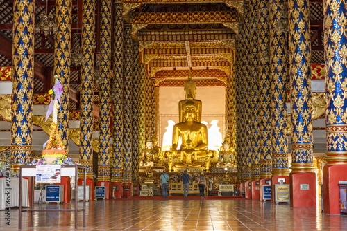 Buddha statues covered with gold leaf inside the Wat Suan Dok, Chiang Mai, Thailand photo