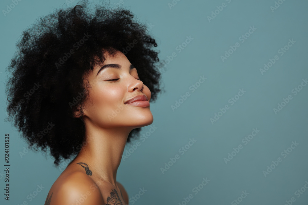 A close up of a woman's face with tattoos and her eyes closed