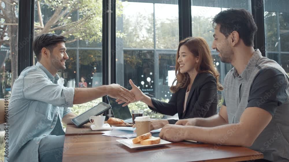 Team of business people meeting and brainstrom on common project and happy in coffee shop. Team of business people meeting and brainstrom on common project and happy in coffee shop.
