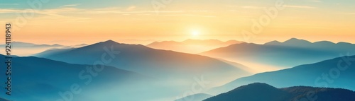 Majestic sunrise over serene mountain ranges, capturing the tranquil beauty of nature with colorful skies and misty peaks.