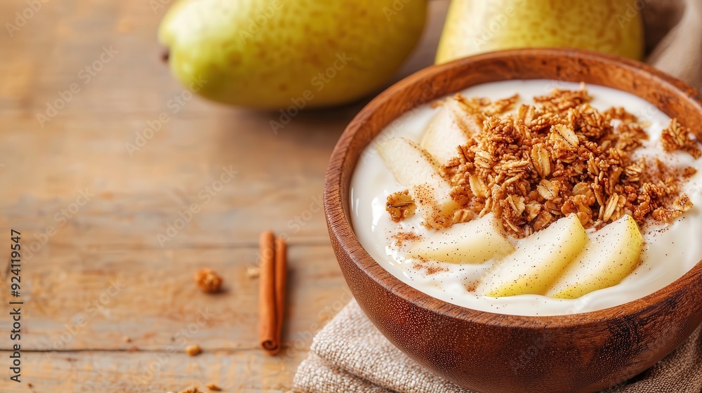 Creamy yogurt with crunchy granola, sliced pears, and a sprinkle of cinnamon, wooden bowl, warm lighting, rustic breakfast idea, cozy and comforting. Creamy yogurt with crunchy granola, sliced pears, and a sprinkle of cinnamon, wooden bowl, warm lighting, rustic breakfast idea, cozy and comforting.
