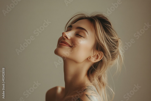 A close up of a woman's face with tattoos and her eyes closed