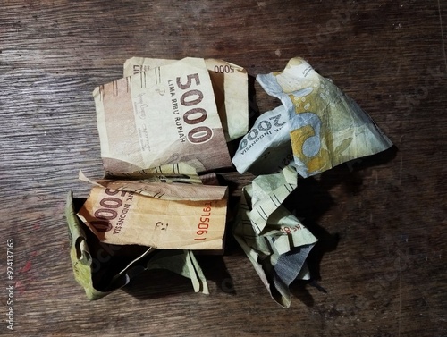 Indonesian currency rupiah on brown table background photo