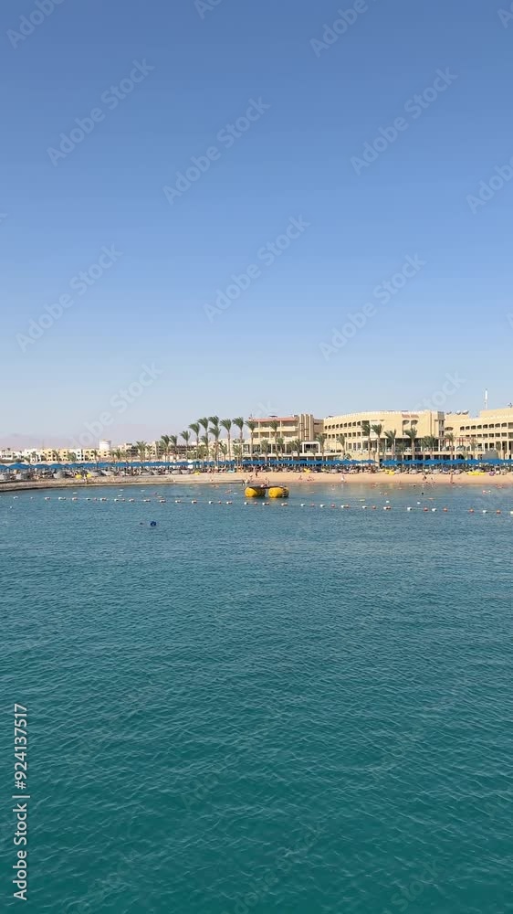 The view of the Red Sea from a cruise ship's deck reveals sparkling blue waters and a serene, expansive horizon. The view of the Red Sea from a cruise ship's deck reveals sparkling blue waters and a serene, expansive horizon.