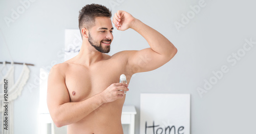 Handsome young man using de...