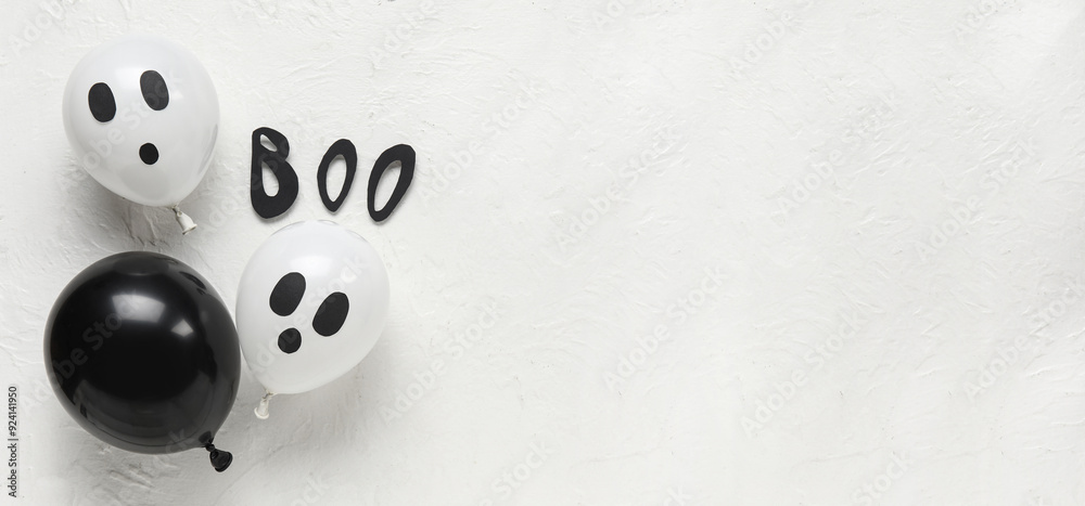 Word BOO with different funny Halloween balloons on white background Word BOO with different funny Halloween balloons on white background