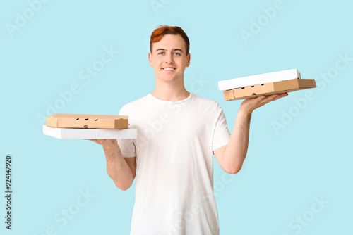 Young man holding cardboard...