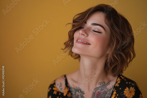 A close up of a woman's face with tattoos and her eyes closed