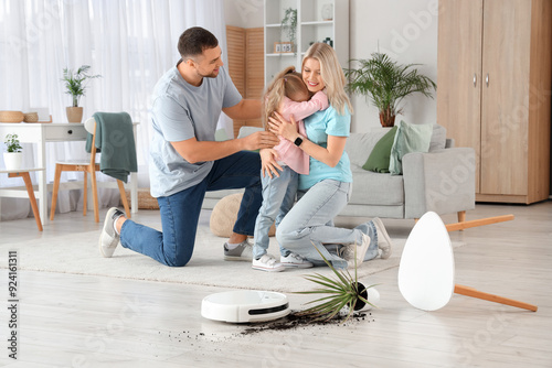 Family with robot vacuum cl...