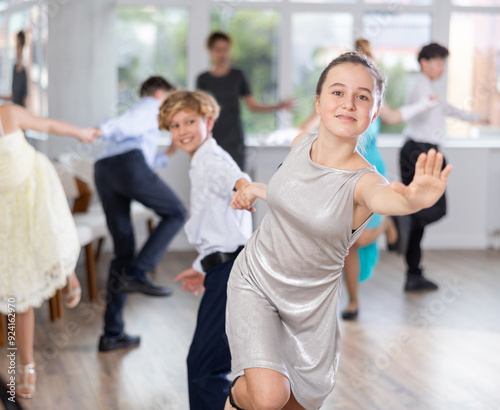 Boy and girl dance energetic twist dance in studio