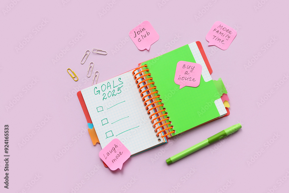 Notebook with empty to do list, sticky notes and stationery on lilac background. New year goals concept Notebook with empty to do list, sticky notes and stationery on lilac background. New year goals concept