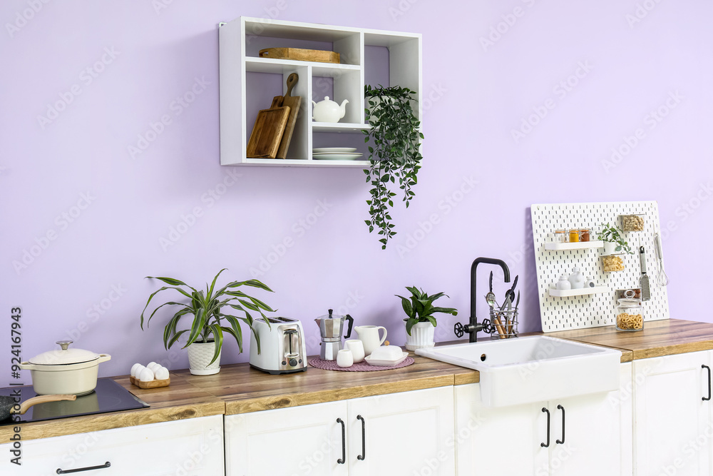 Interior of modern kitchen with sink and toaster Interior of modern kitchen with sink and toaster