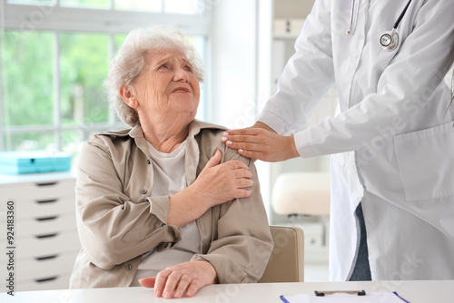 Ill senior woman visiting doctor in clinic